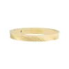 Anello Harlow con texture lineare in acciaio inossidabile color oro