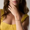 Bracciale Ellis con forme miste in ottone dorato