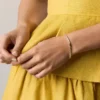 Bracciale tennis Sutton Love-All in ottone dorato con maglie a forma di cuore