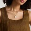 Collana con pendente in acciaio inossidabile dorato e madreperla bianca Gemini Sutton Zodiac