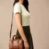 Mini borsa a tracolla in pelle Carlie